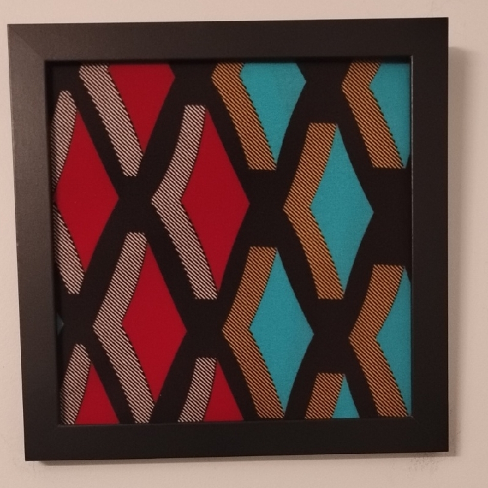 Geometric Patterned Wall Art in Red, Blue, and Gold